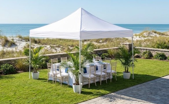 10x10 pop-up canopy tent rental set up for a small outdoor party in Myrtle Beach.
