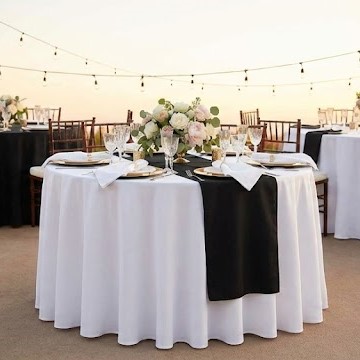 Elegant white table linens and napkins professionally set for a formal event in Myrtle Beach